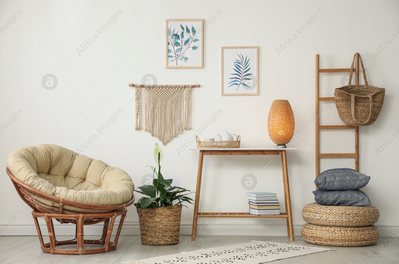 Photo of Living room interior design with comfortable papasan chair and wooden table