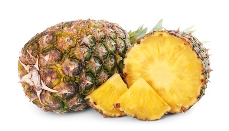 Photo of Whole and cut tasty ripe pineapples isolated on white