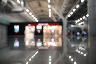 Photo of Blurred view of modern shop in airport