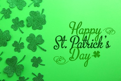 Image of Happy St. Patrick's day card. Text and decorative clover leaves on green background, top view