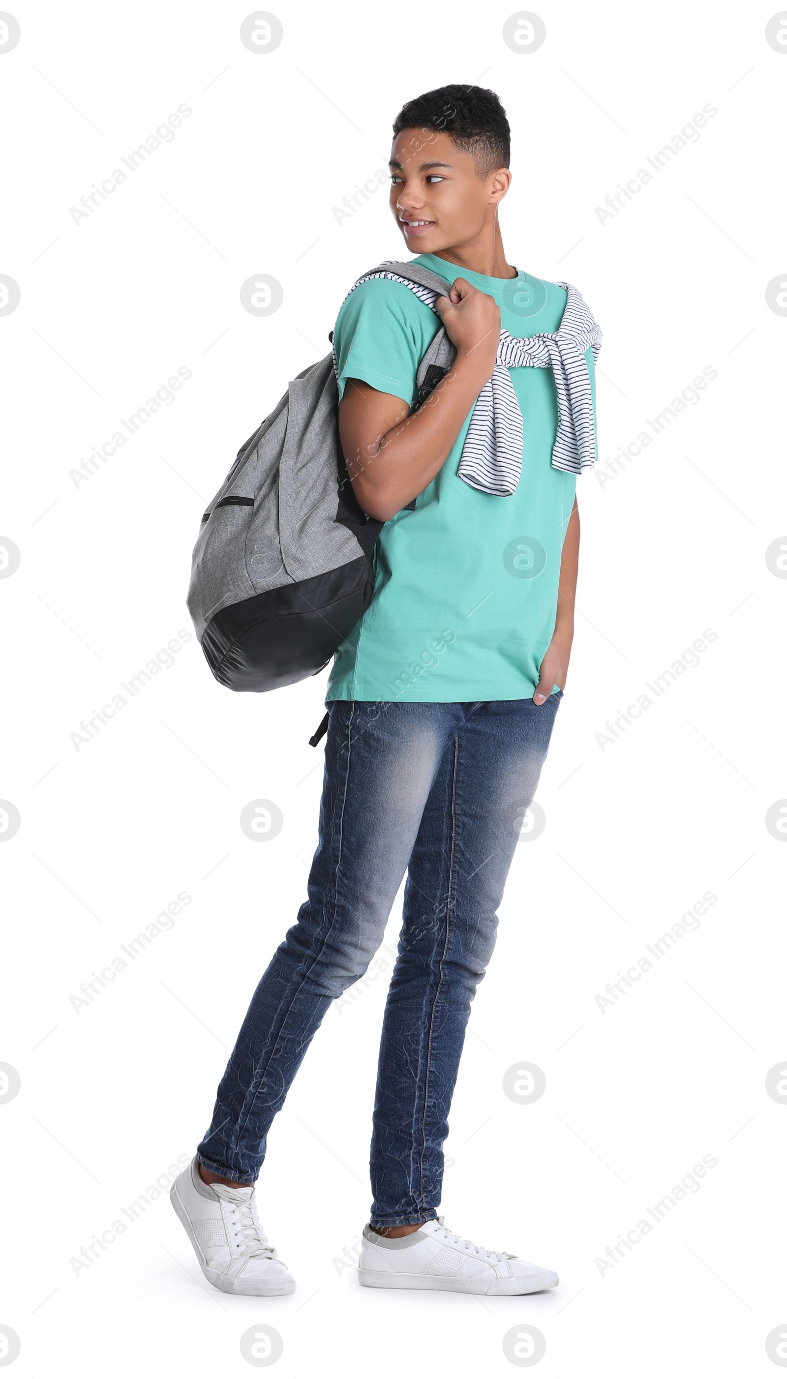 Photo of African-American teenage boy with backpack on white background