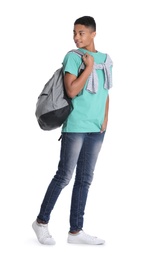 African-American teenage boy with backpack on white background