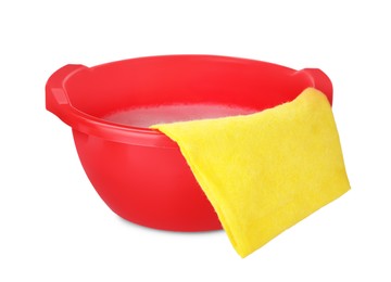 Photo of Red basin with detergent and rag on white background