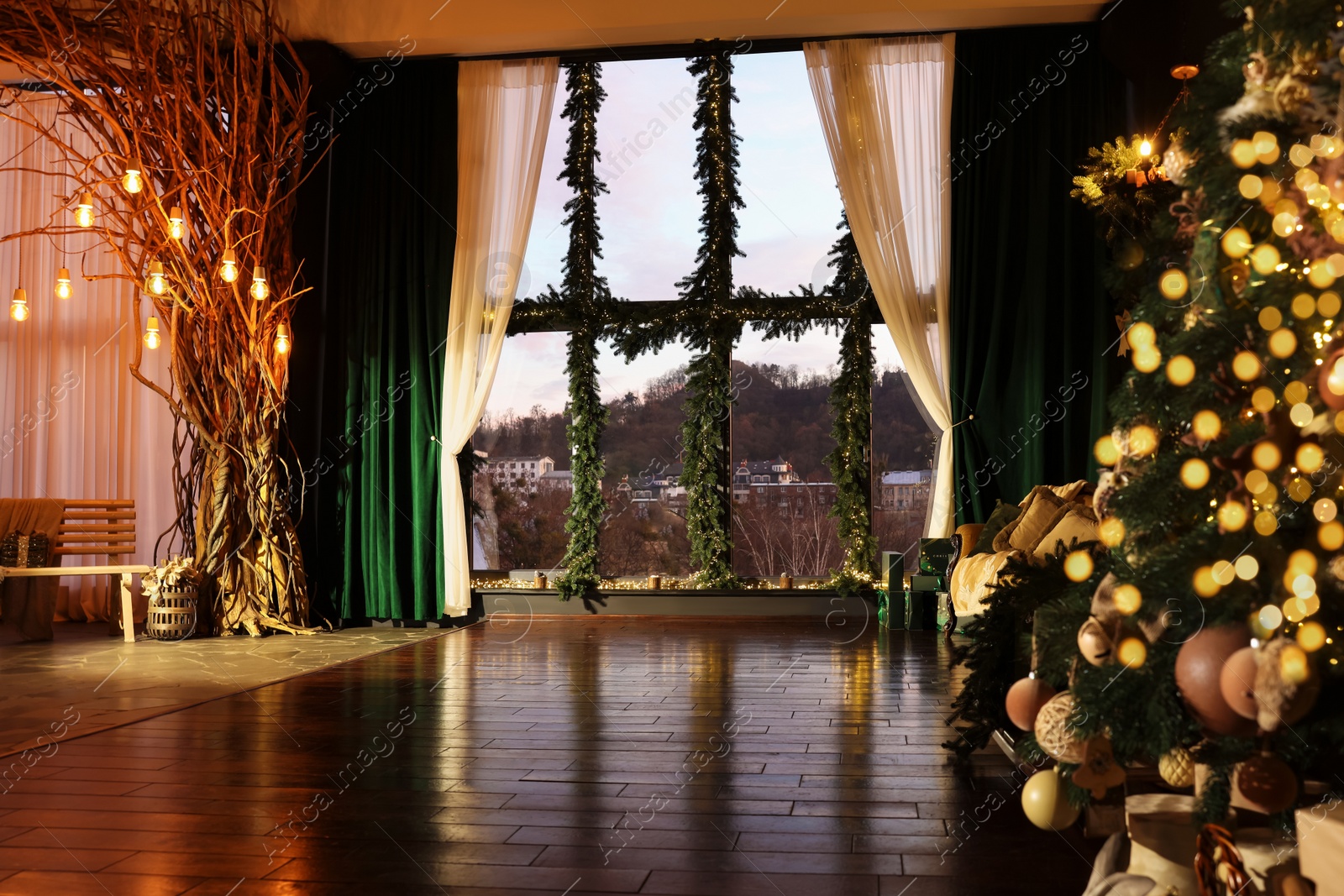 Photo of Beautiful Christmas tree in room with festive decor