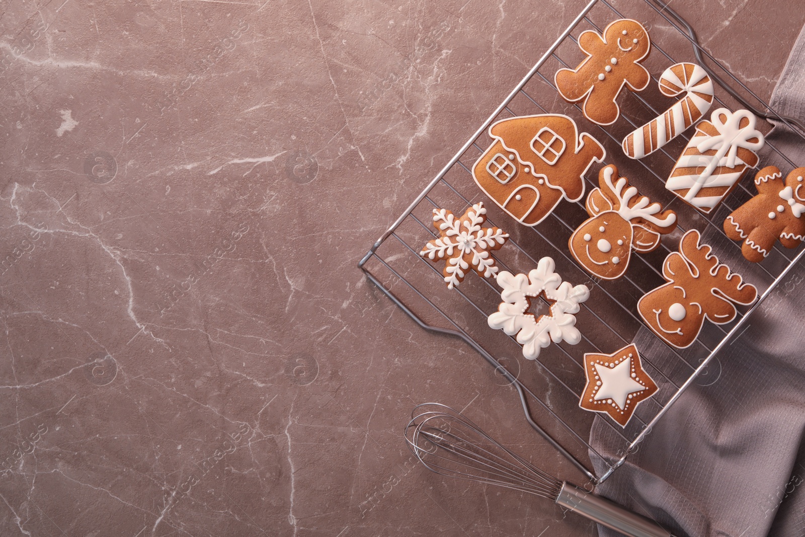 Photo of Delicious Christmas cookies on marble table, flat lay with space for text