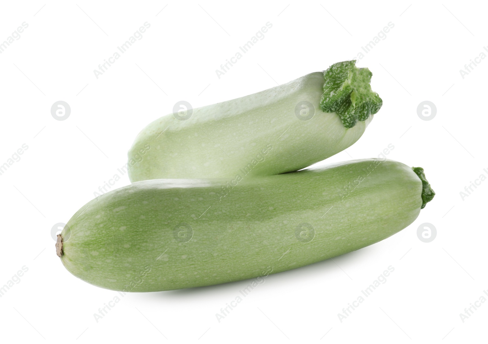 Photo of Fresh ripe zucchini squashes on white background