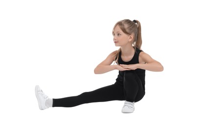 Little girl doing morning exercise on white background