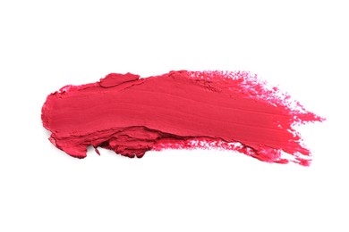 Photo of Smears of bright lipstick on white background, top view