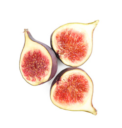 Photo of Halves of tasty fresh figs on white background, top view