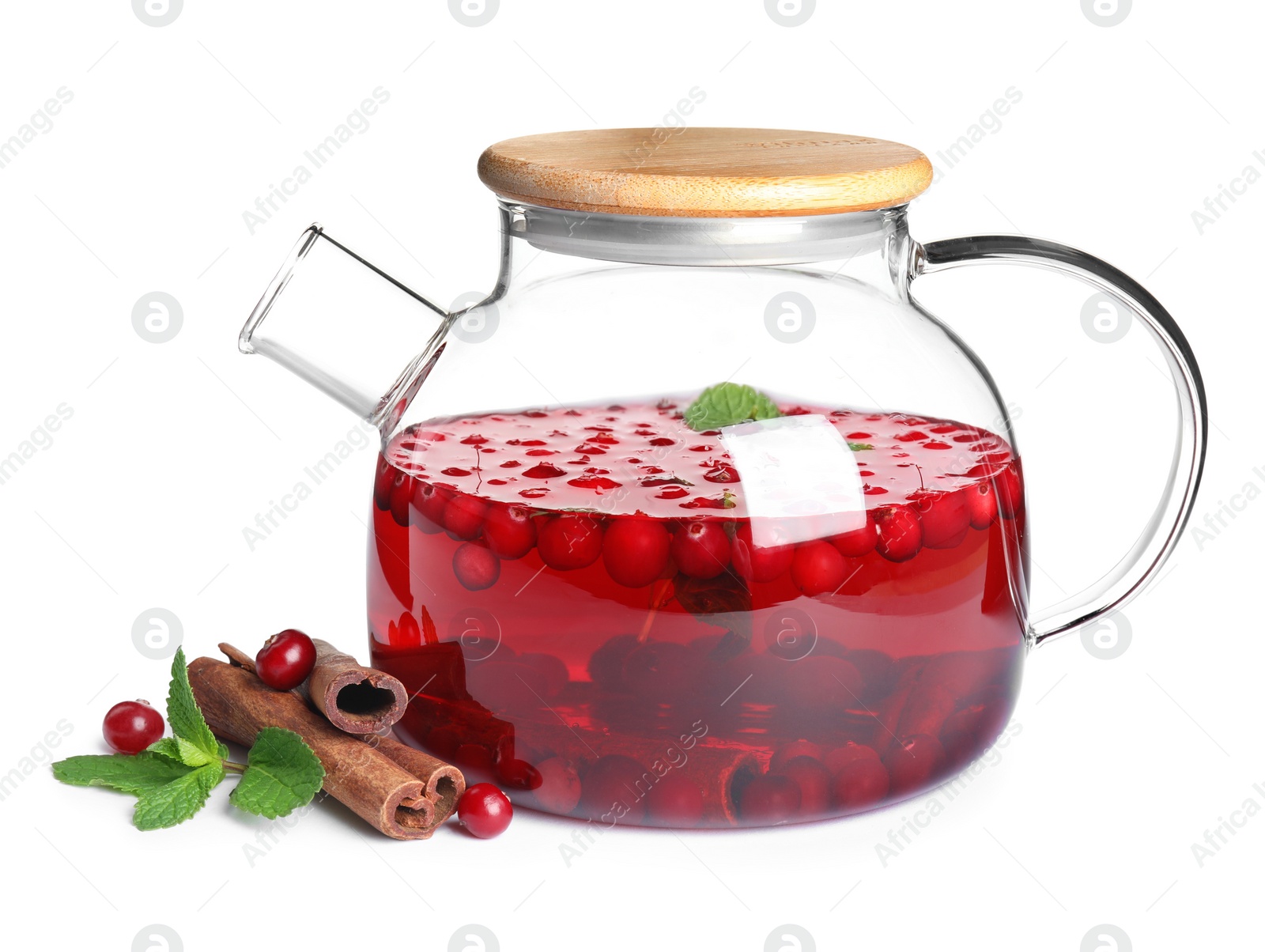 Photo of Tasty hot cranberry tea with mint and cinnamon in teapot on white background