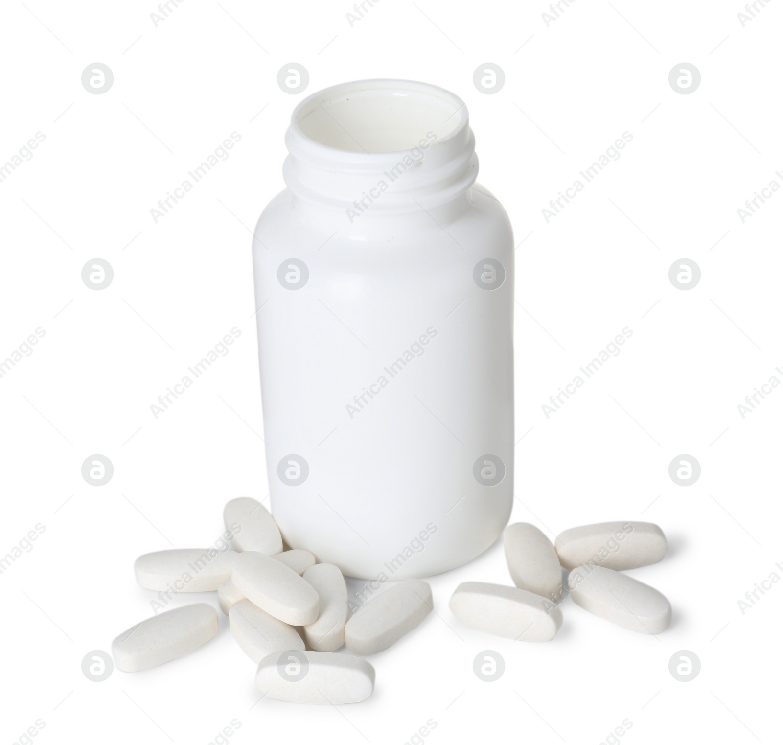 Photo of Bottle and pile of vitamin pills isolated on white