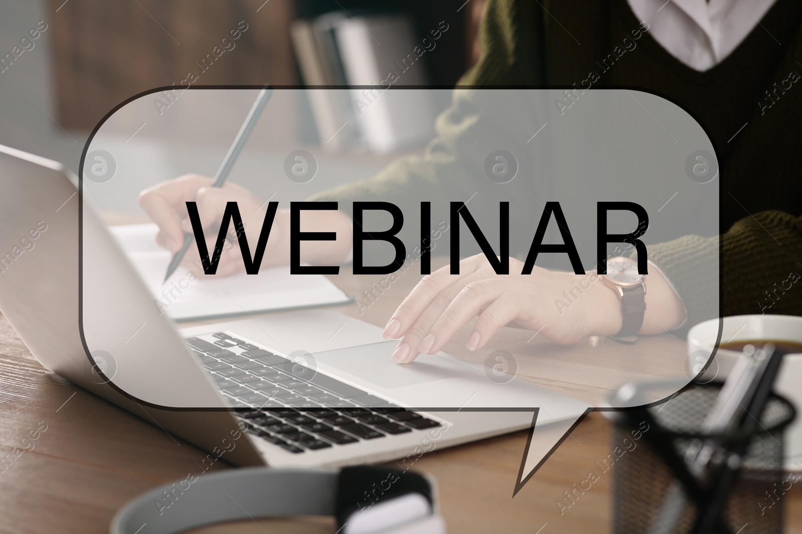 Image of Webinar concept. Woman working with laptop at table indoors, closeup