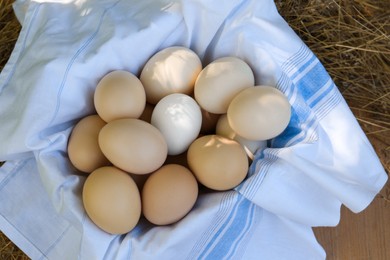 Photo of Fresh raw eggs on table, top view