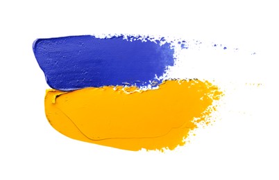 Photo of Blue and orange oil paint strokes on white background, top view