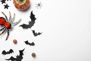 Halloween decor elements on white background, flat lay. Space for text