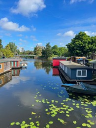 Beautiful view of canal with floating houses and boat