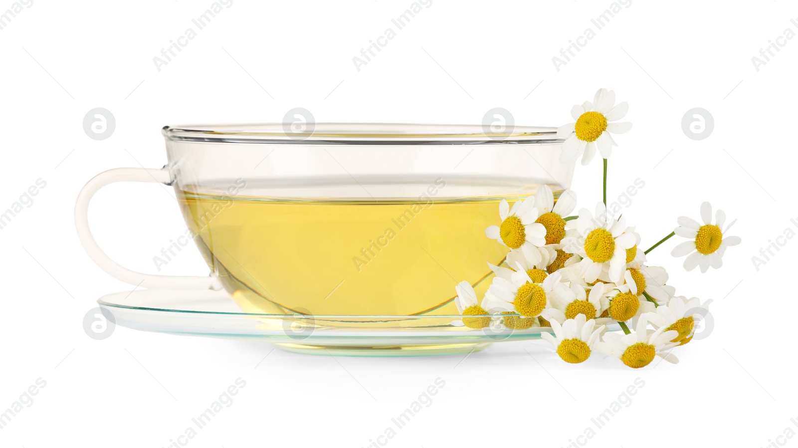 Photo of Aromatic herbal tea in glass cup and chamomiles isolated on white