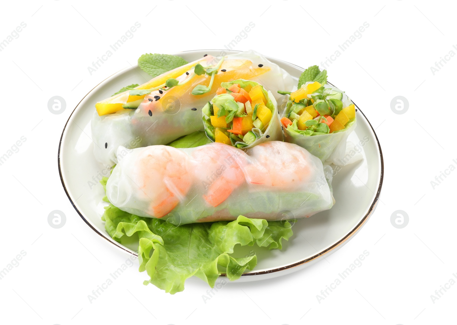 Photo of Plate with tasty spring rolls isolated on white