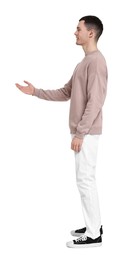 Photo of Handsome young man greeting someone on white background