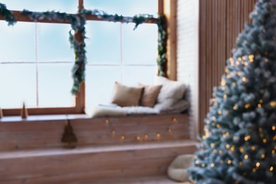 Blurred view of room with Christmas tree and festive decor