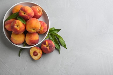 Photo of Fresh sweet peaches on light table, flat lay. Space for text