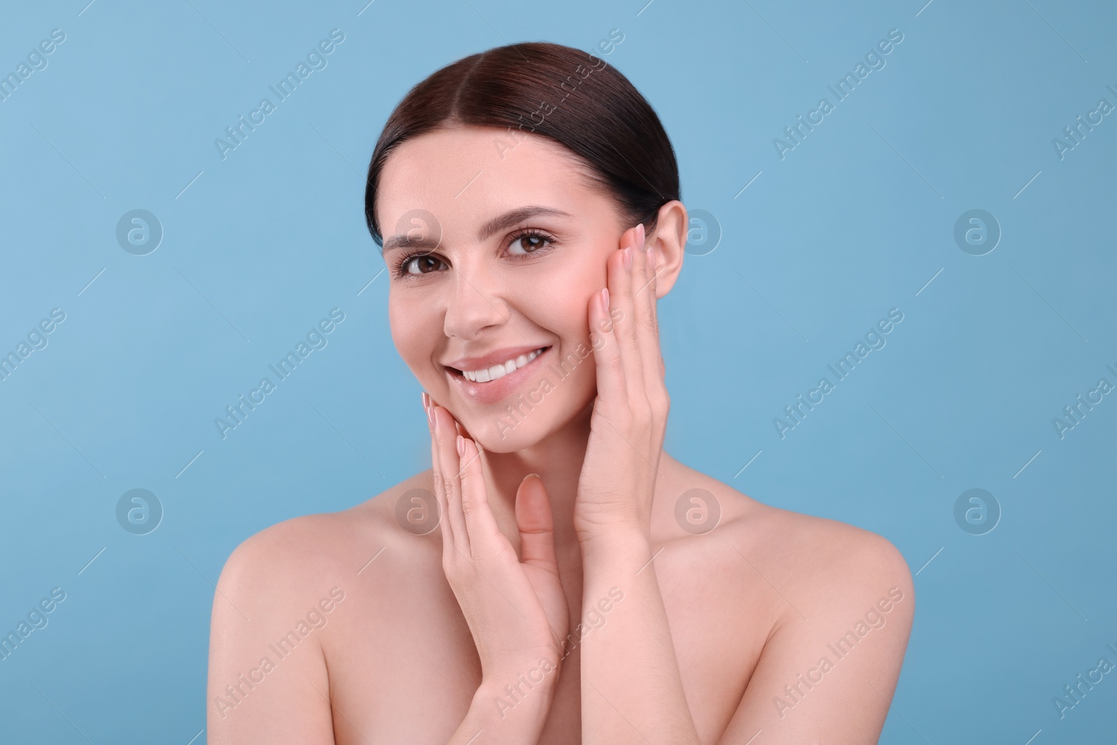 Photo of Beautiful woman with healthy skin on light blue background. Body Care