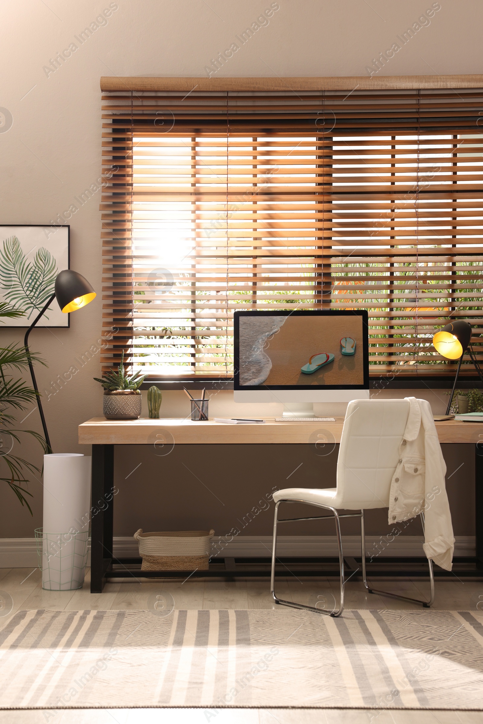 Photo of Light room interior with comfortable workplace near window