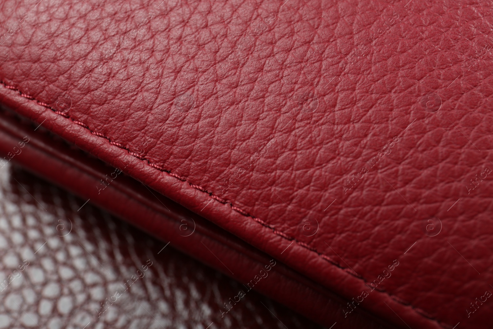 Photo of Beautiful red leather as background, closeup view