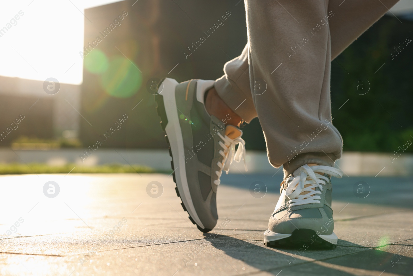 Photo of Man wearing stylish sneakers outdoors, closeup. Space for text