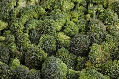 Fresh raw broccoli as background, closeup view