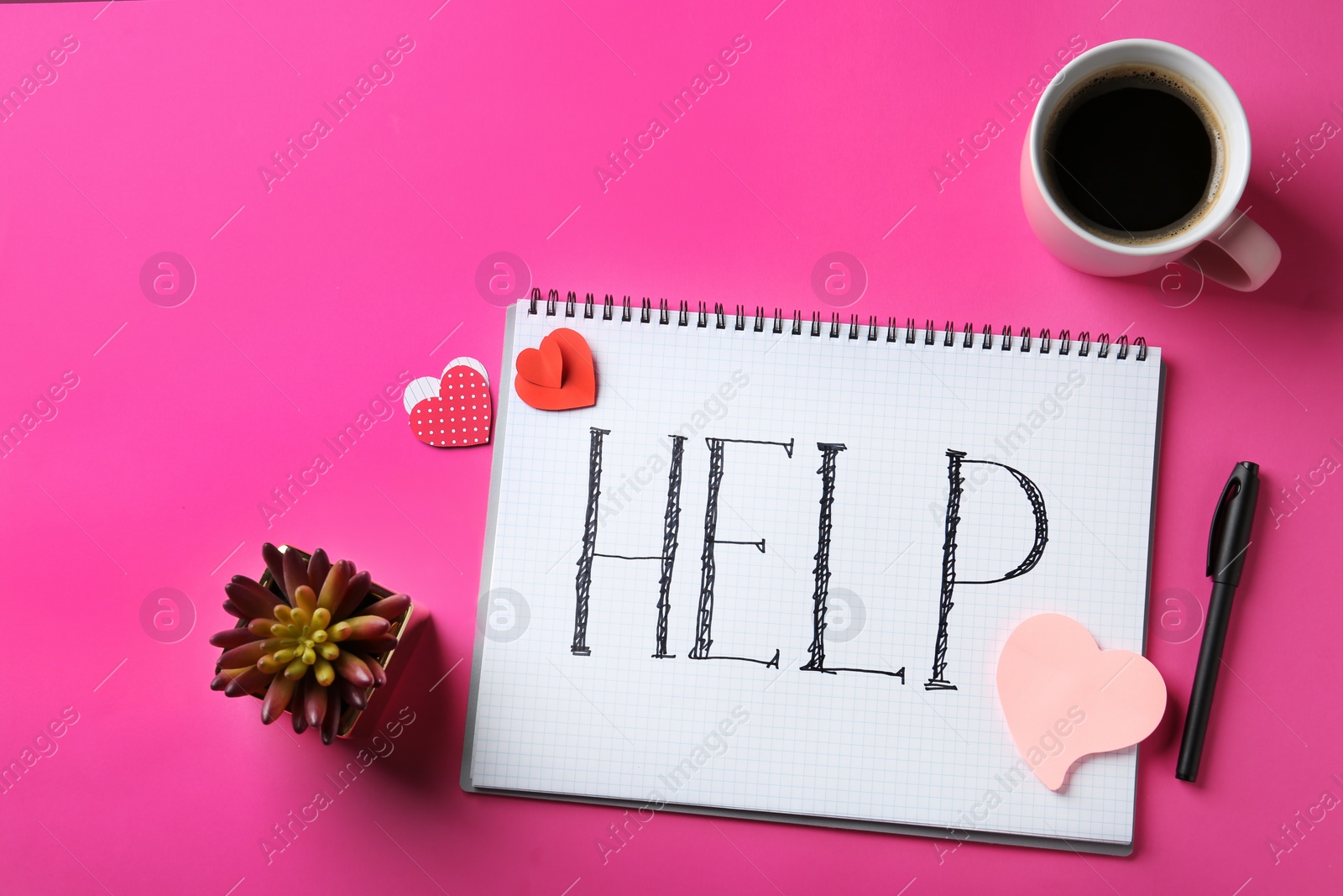 Photo of Flat lay composition with paper hearts, cup of coffee, notebook and word HELP on color background