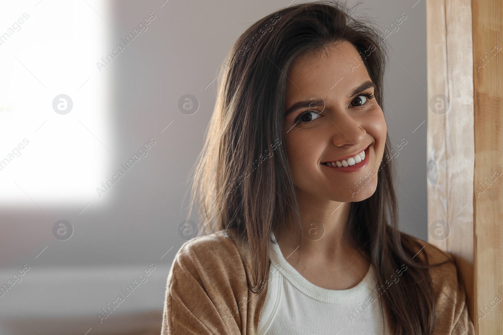 Photo of Portrait of beautiful young woman indoors, space for text