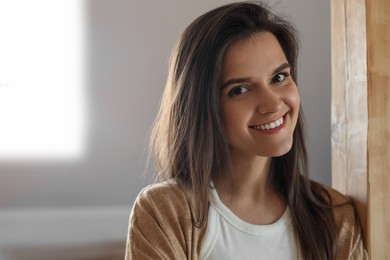 Photo of Portrait of beautiful young woman indoors, space for text