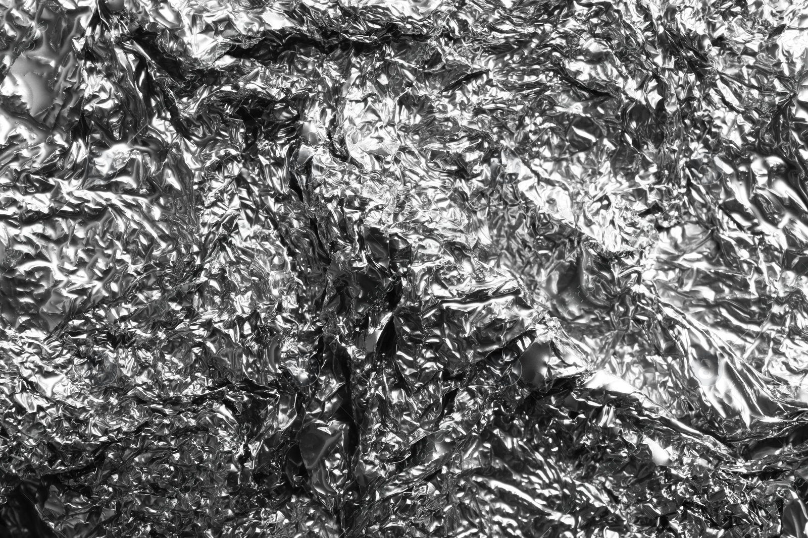 Image of Crumpled silver foil as background, closeup view