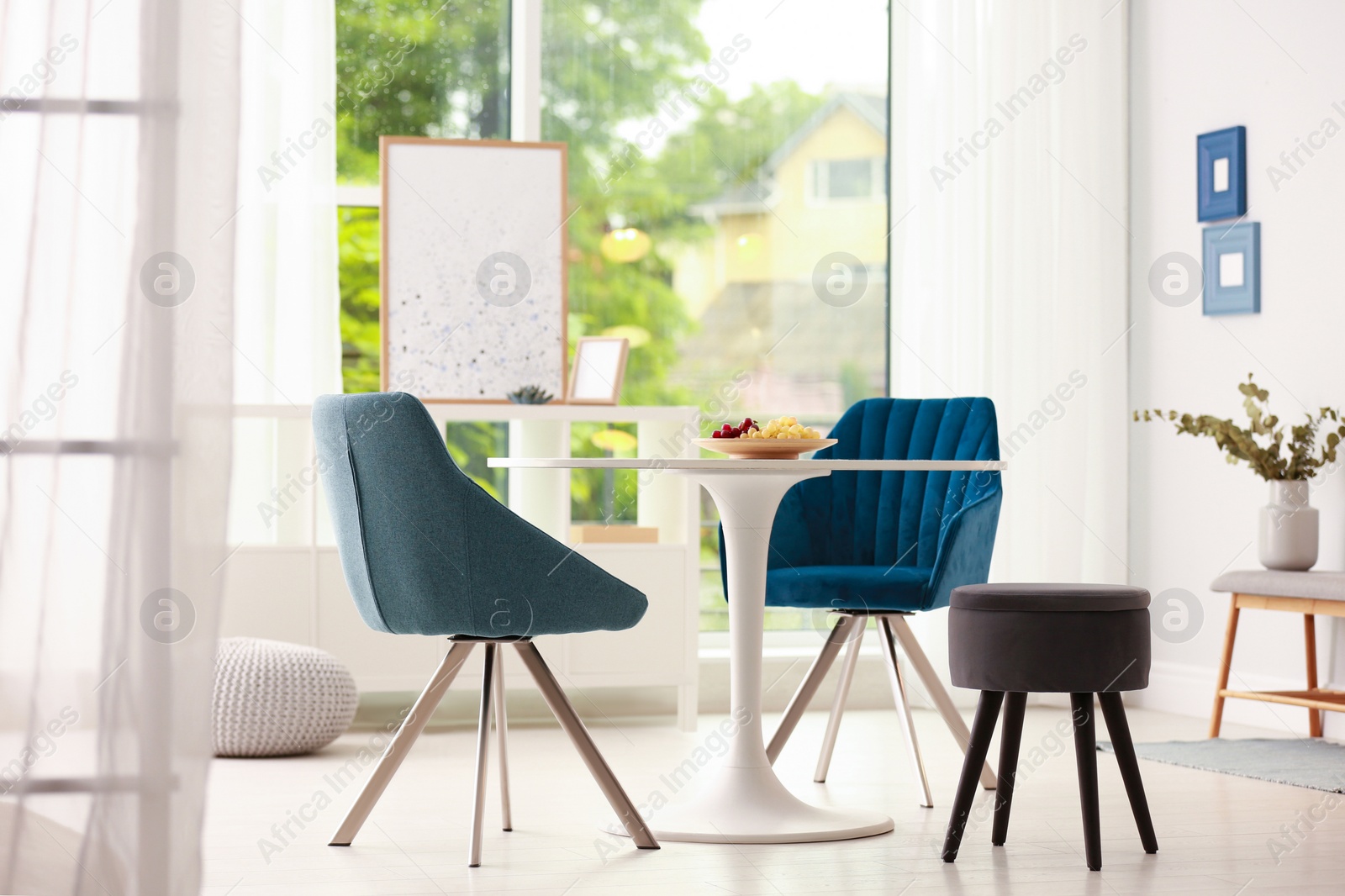 Photo of Modern dining room interior with table and chairs