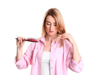 Photo of Young woman brushing hair against white background