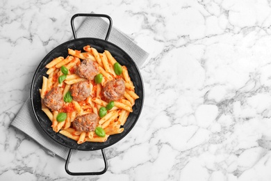 Photo of Pasta with meatballs and tomato sauce on light background