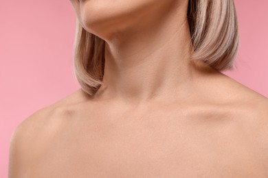 Photo of Woman with healthy skin on pink background, closeup