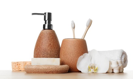 Bath accessories. Different personal care products and flower on wooden table against white background