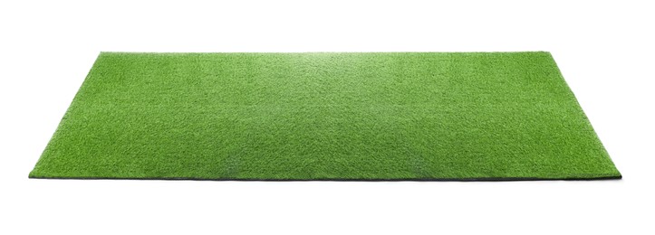 Photo of Green artificial grass carpet isolated on white