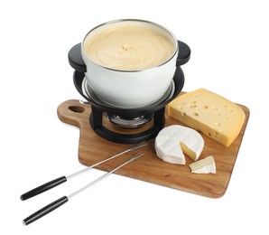 Photo of Fondue with tasty melted cheese, forks and pieces isolated on white