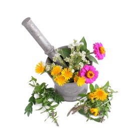 Photo of Mortar with different flowers and pestle on white background