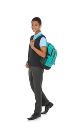 Photo of Full length portrait of African-American boy in school uniform with backpack on white background