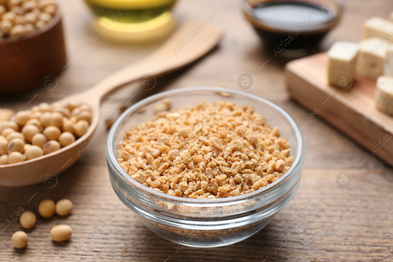 Photo of Dried soy meat and other products on wooden table, closeup