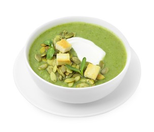 Photo of Delicious broccoli cream soup with croutons, sour cream and pumpkin seeds isolated on white