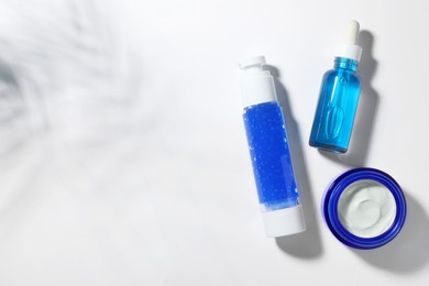 Photo of Set of cosmetic products on white background, flat lay. Space for text