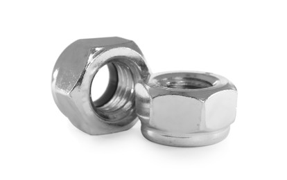 Photo of Two metal nyloc nuts on white background