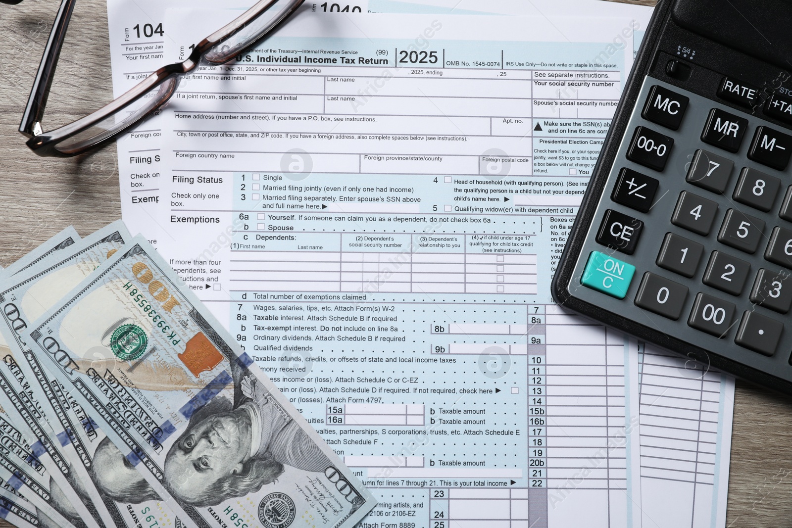 Photo of Payroll. Tax return forms, dollar banknotes, glasses and calculator on wooden table, flat lay