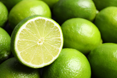 Fresh ripe juicy limes as background, closeup