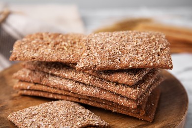 Photo of Stack of dry rye crispbreads on table, closeup